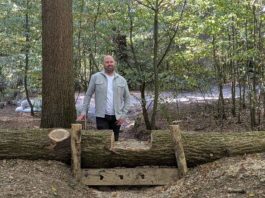Council Launches Three Flood‑Alleviation Projects in Ruislip Cllr Adam Bennett at a leaky dam in Park Wood